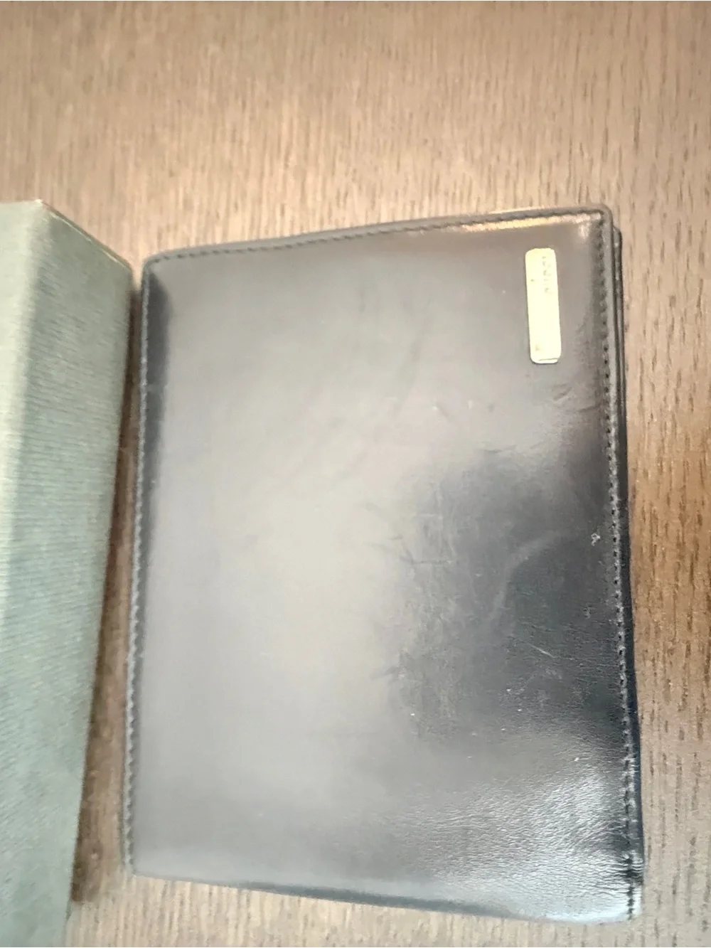 Gucci Black Smooth Leather Bifold Wallet with Metal Plaque